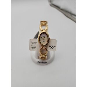 NWT Ladies Armitron Hammered Gold Tone watch genuine diamond dial